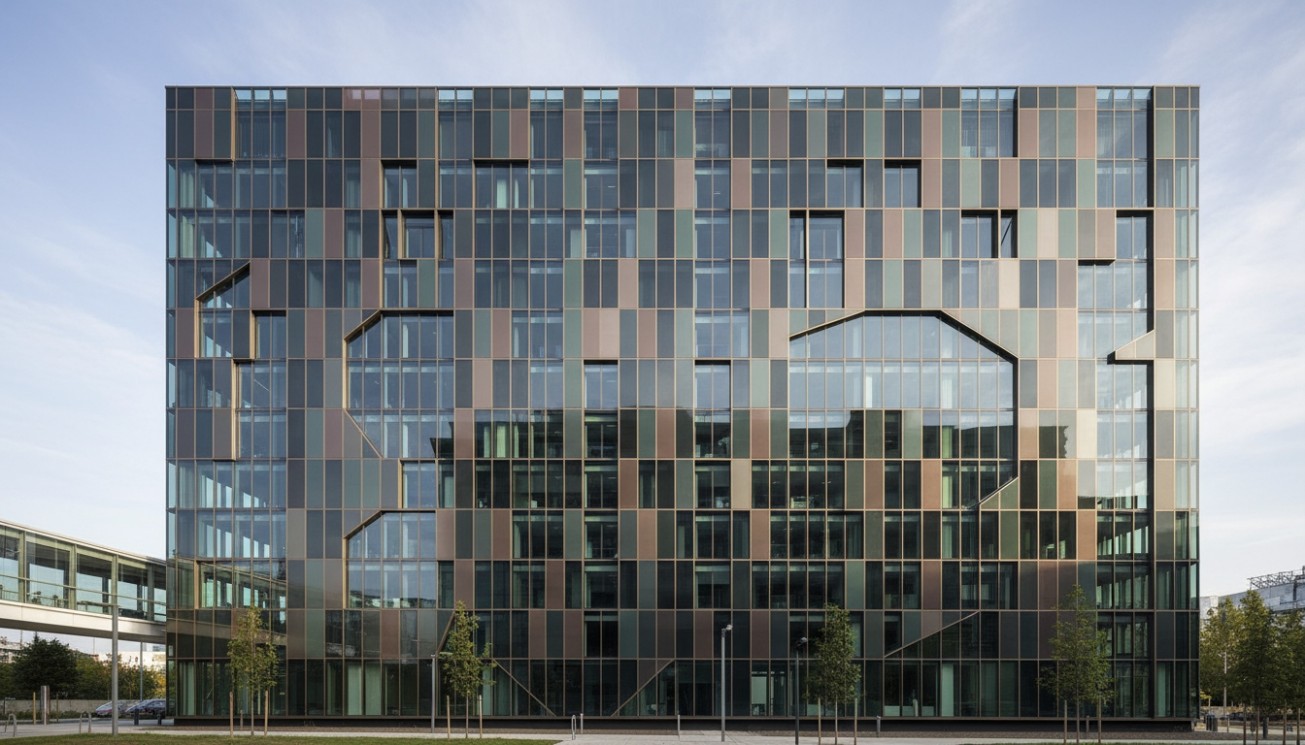 Custom solar facade using active and passive photovoltaic glass panels to maintain architectural rhythm and visual consistency